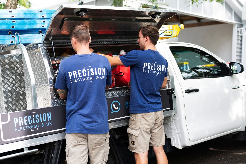 Precision Electrical & Air electricians loading their work ute