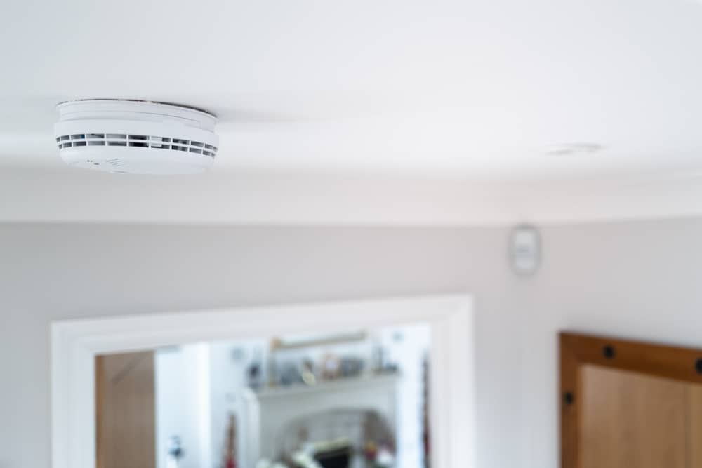 Smoke alarm being installed