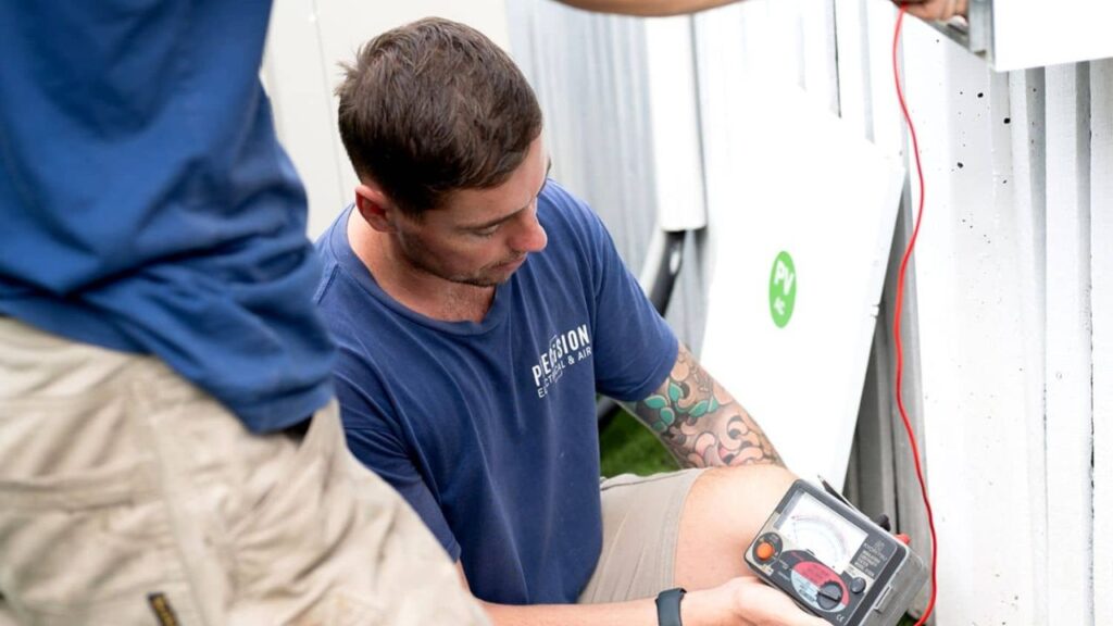 Precision electrician carrying out electrical work