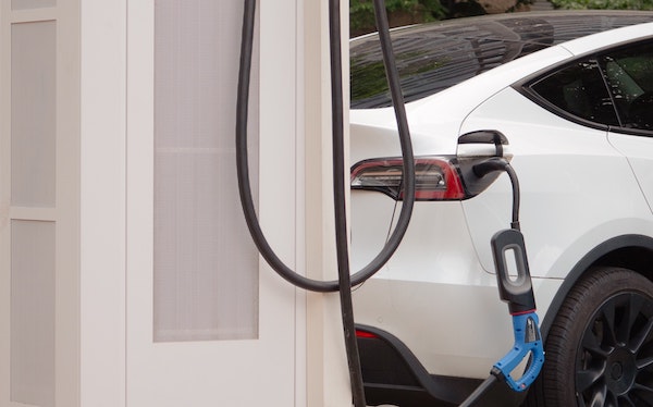 Electric vehicle plugged into a home charger
