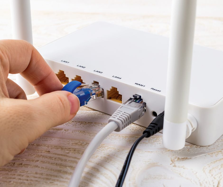 Ethernet cable plugged into a wall data point