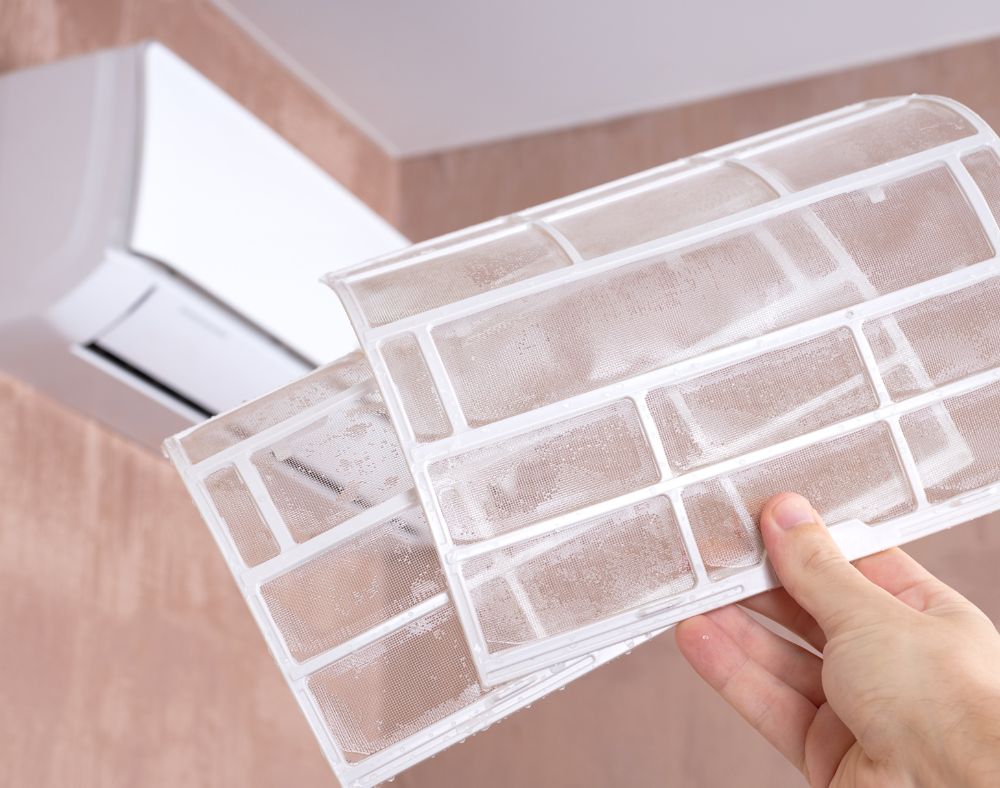 Dusty air conditioner filters before cleaning