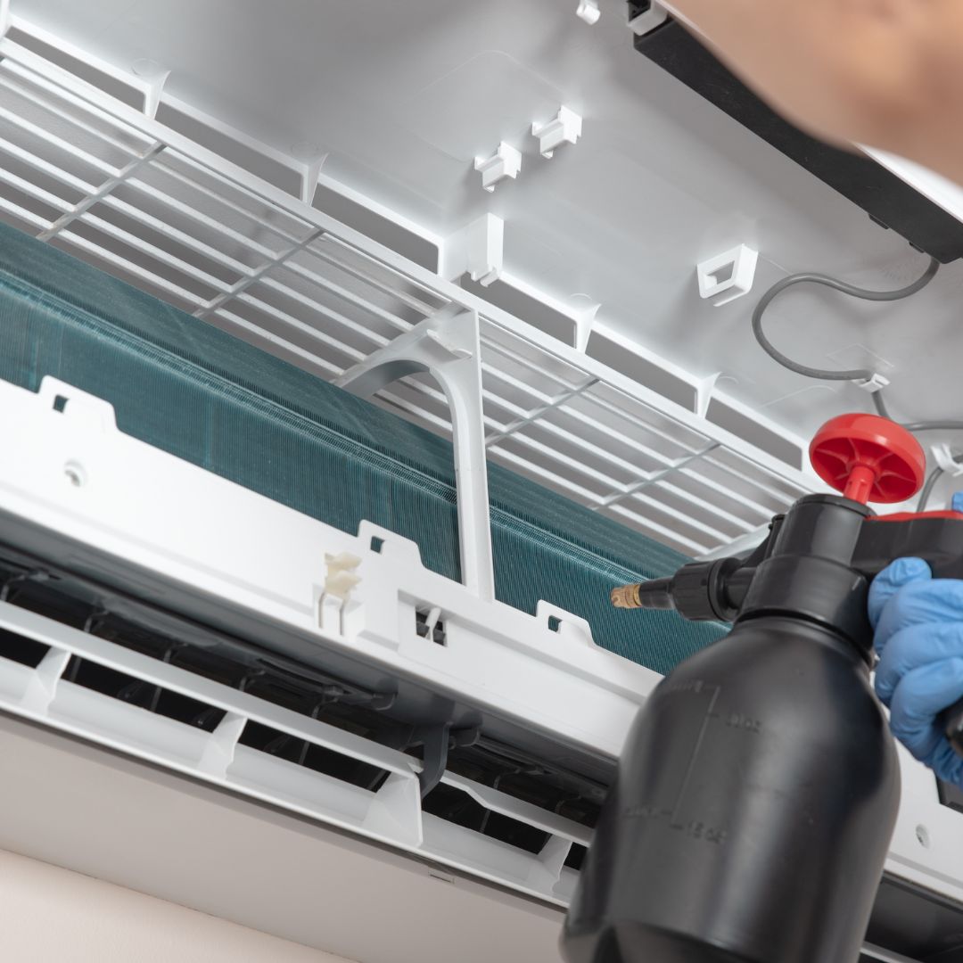 Split system air conditioner being serviced