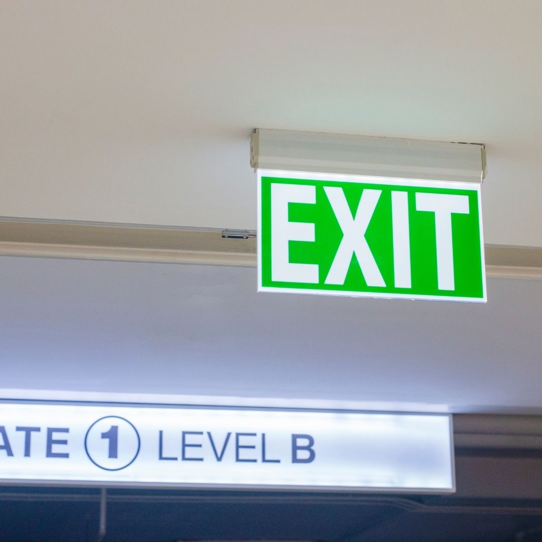 Illuminated exit sign in a commercial building