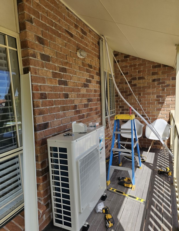 Pulling air conditioning conduits through